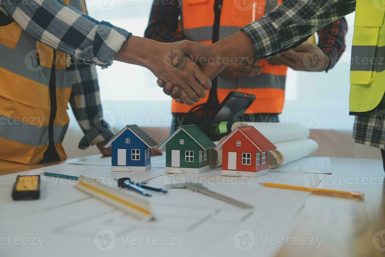 Construction and structure concept of Engineer or architect meeting for project working with partner and engineering tools on model building and blueprint in working site, contract for both companies. photo