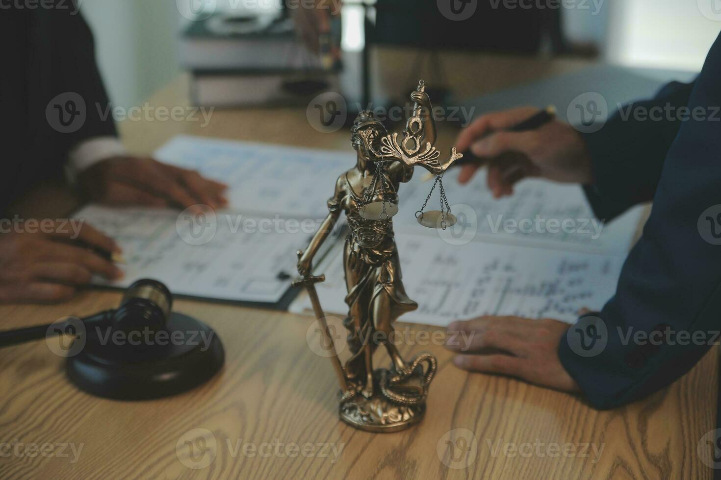 Consultation and conference of Male lawyers and professional businesswoman working and discussion having at law firm in office. Concepts of law, Judge gavel with scales of justice. photo