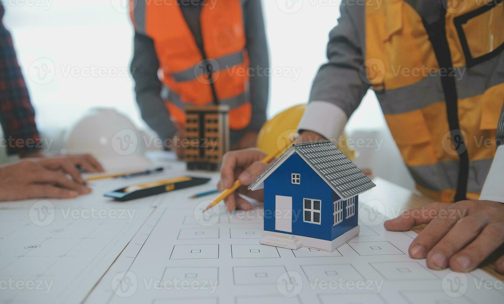 Construction and structure concept of Engineer or architect meeting for project working with partner and engineering tools on model building and blueprint in working site, contract for both companies. photo