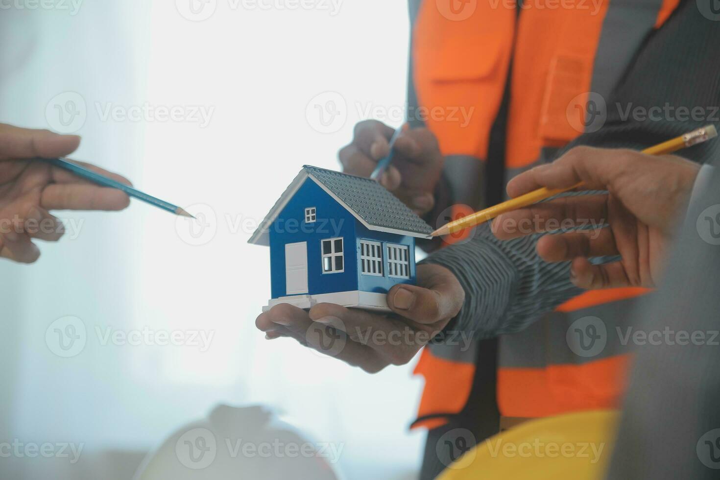 Construction and structure concept of Engineer or architect meeting for project working with partner and engineering tools on model building and blueprint in working site, contract for both companies. photo