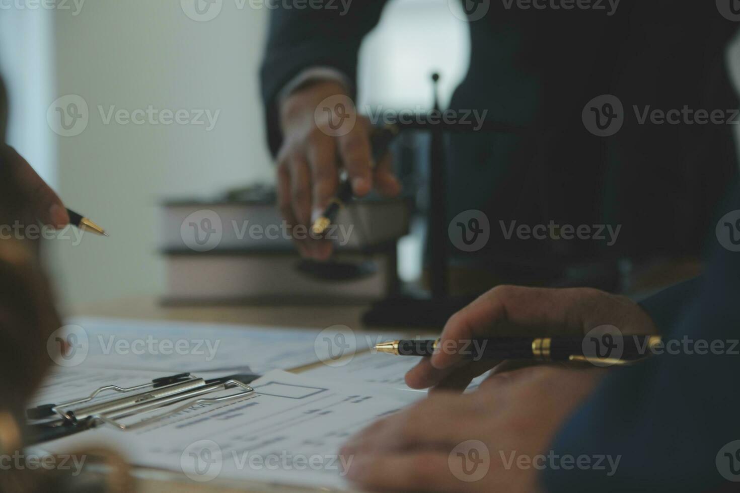 Consultation and conference of Male lawyers and professional businesswoman working and discussion having at law firm in office. Concepts of law, Judge gavel with scales of justice. photo