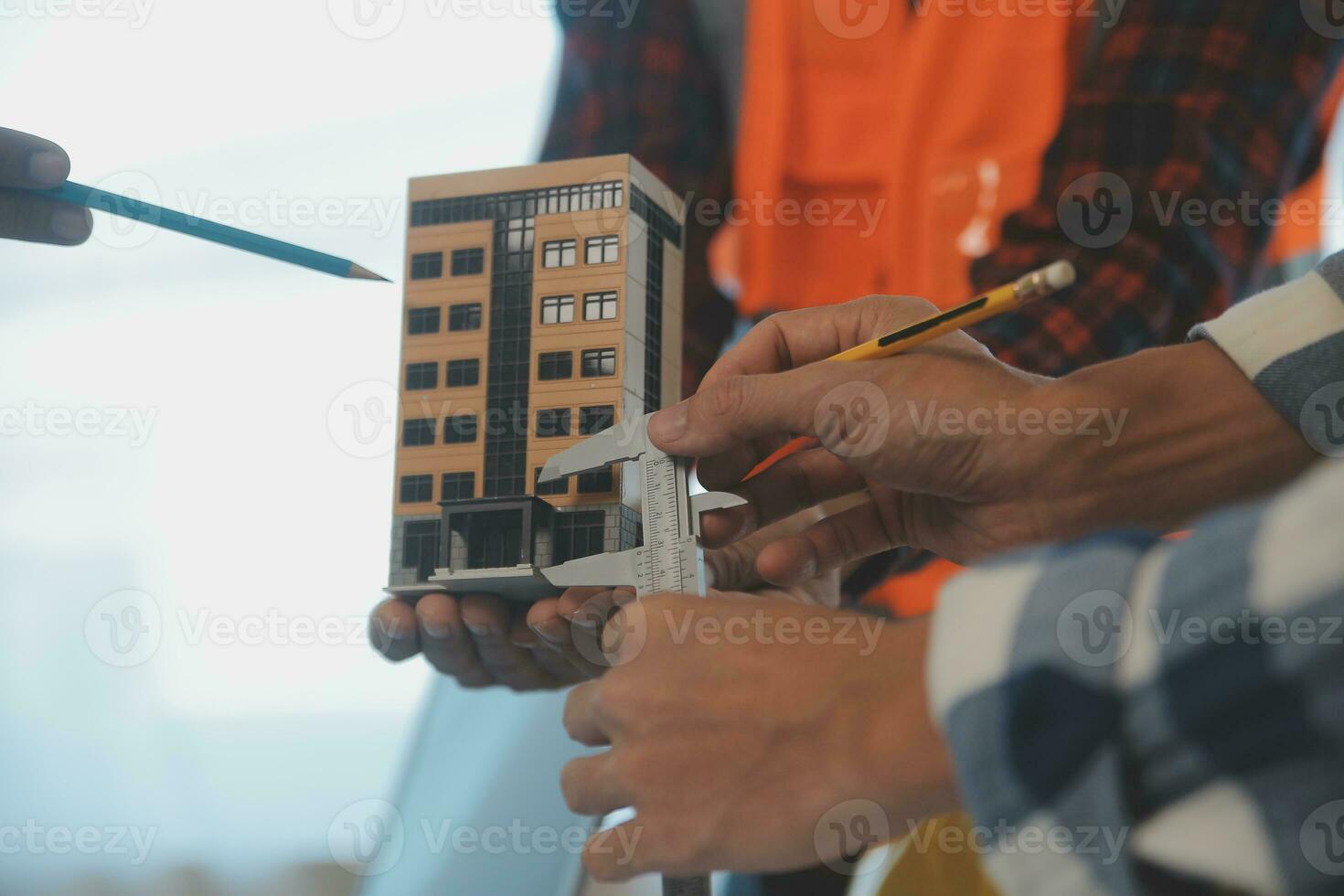 Construction and structure concept of Engineer or architect meeting for project working with partner and engineering tools on model building and blueprint in working site, contract for both companies. photo