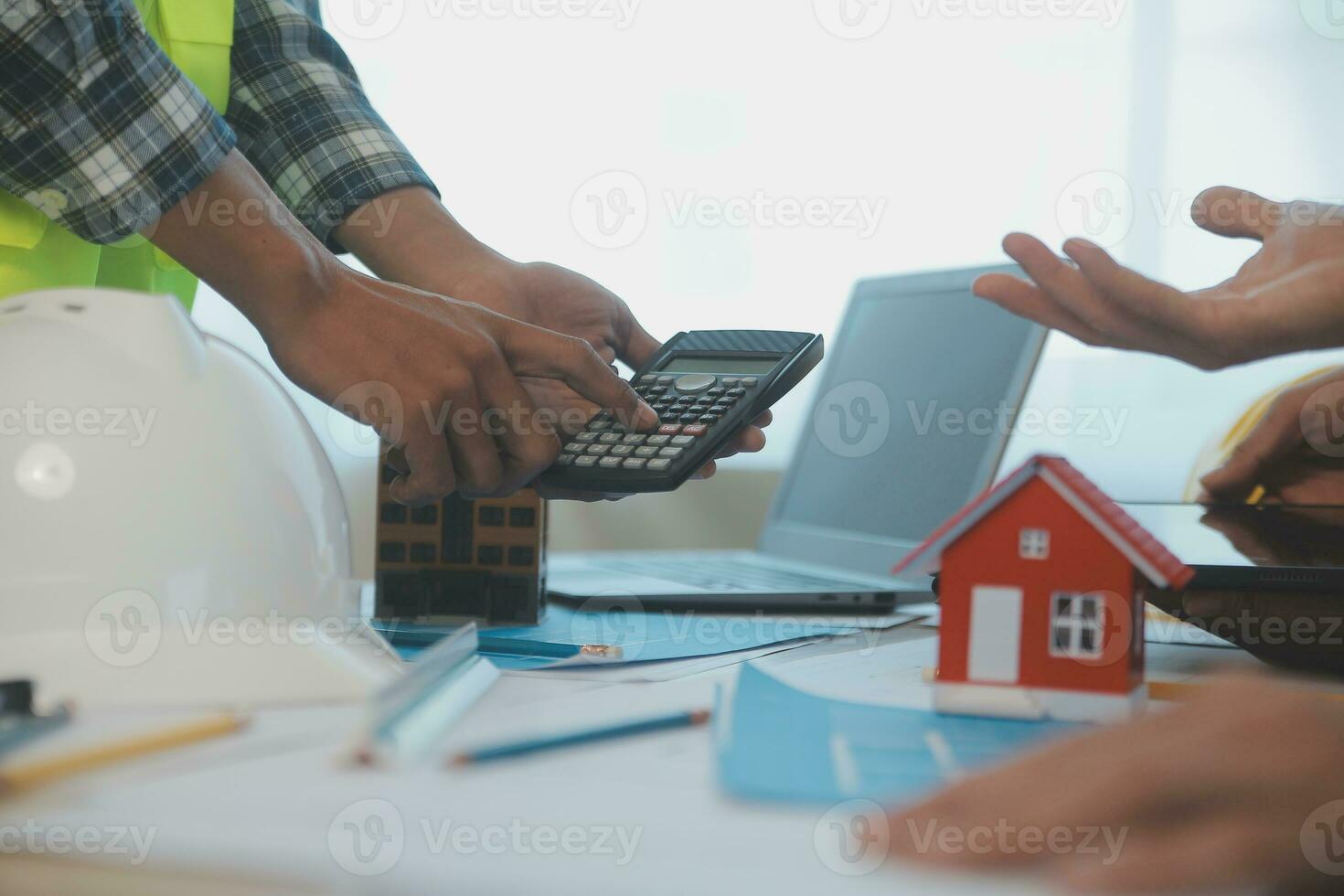 Construction and structure concept of Engineer or architect meeting for project working with partner and engineering tools on model building and blueprint in working site, contract for both companies. photo