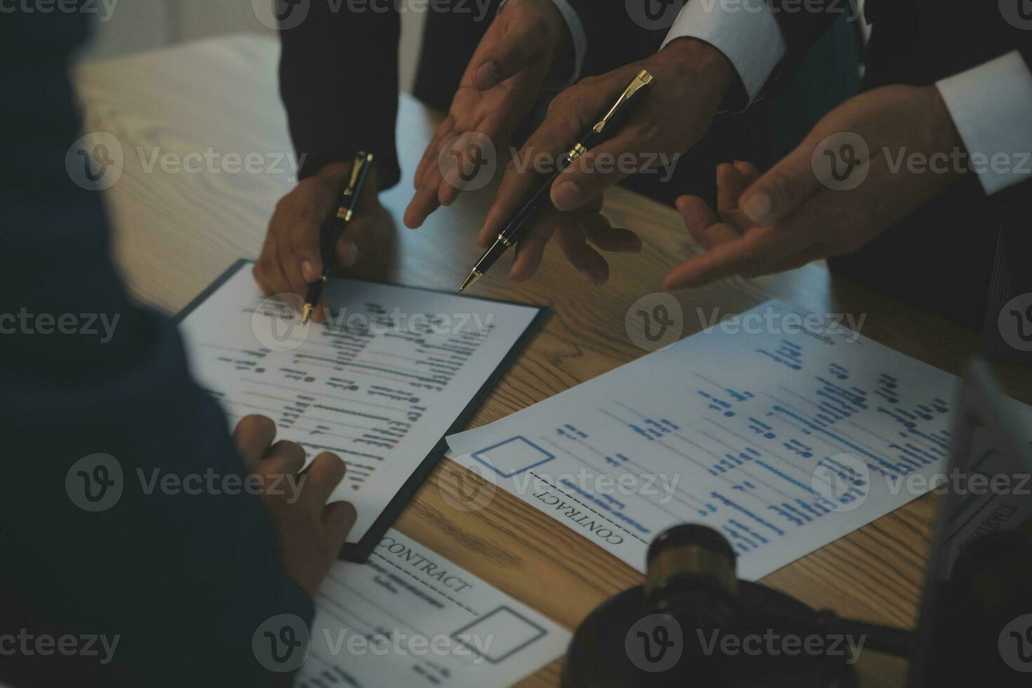 Consultation and conference of Male lawyers and professional businesswoman working and discussion having at law firm in office. Concepts of law, Judge gavel with scales of justice. photo