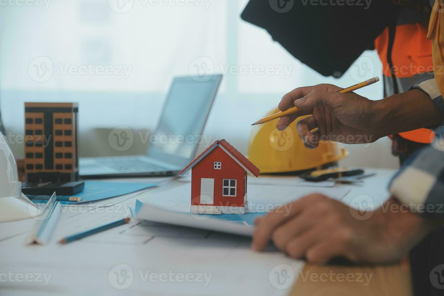 Construction and structure concept of Engineer or architect meeting for project working with partner and engineering tools on model building and blueprint in working site, contract for both companies. photo