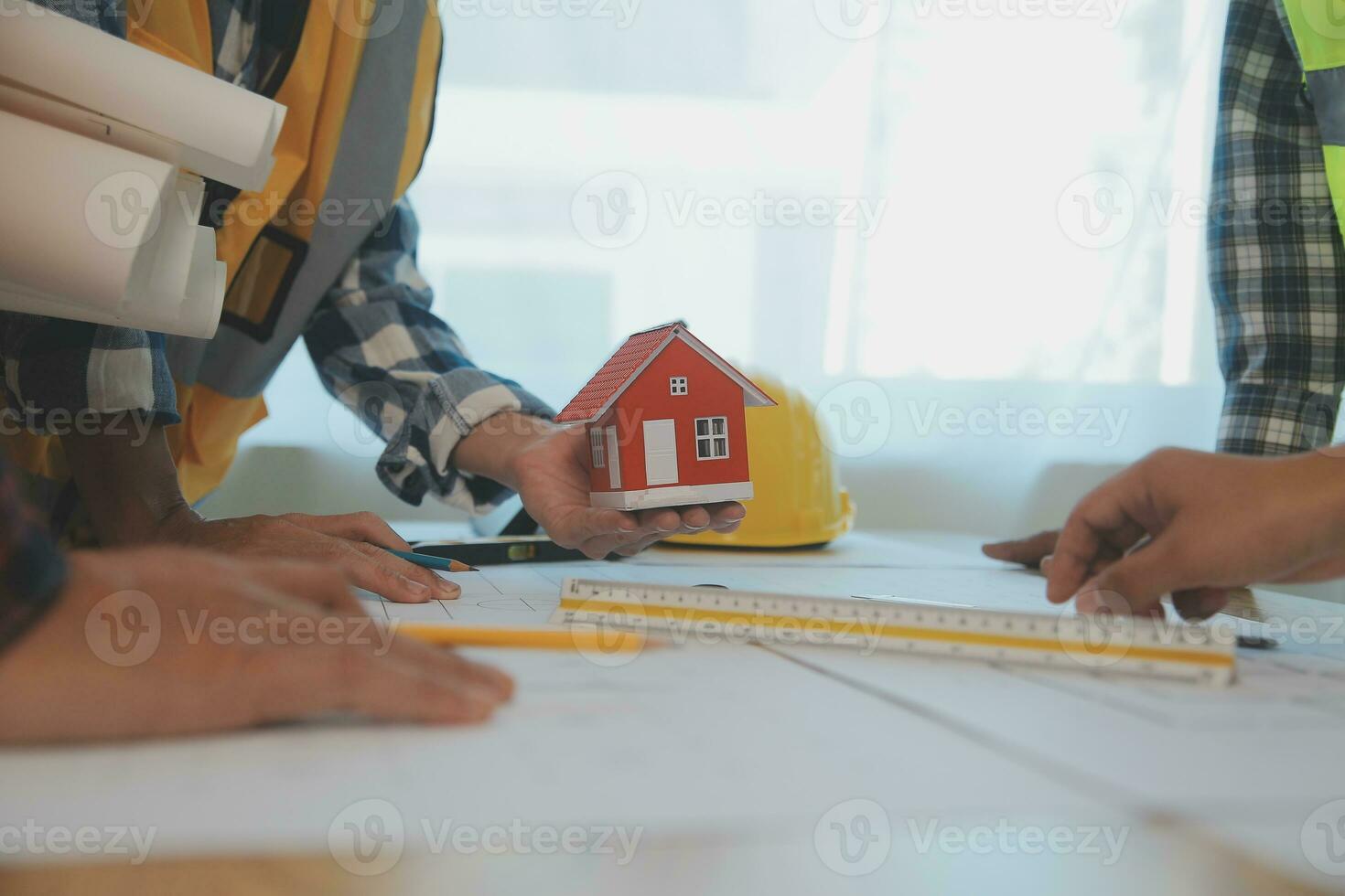 Construction and structure concept of Engineer or architect meeting for project working with partner and engineering tools on model building and blueprint in working site, contract for both companies. photo