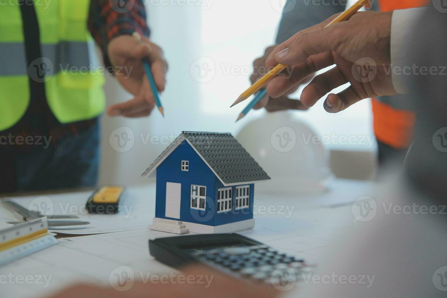 Construction and structure concept of Engineer or architect meeting for project working with partner and engineering tools on model building and blueprint in working site, contract for both companies. photo