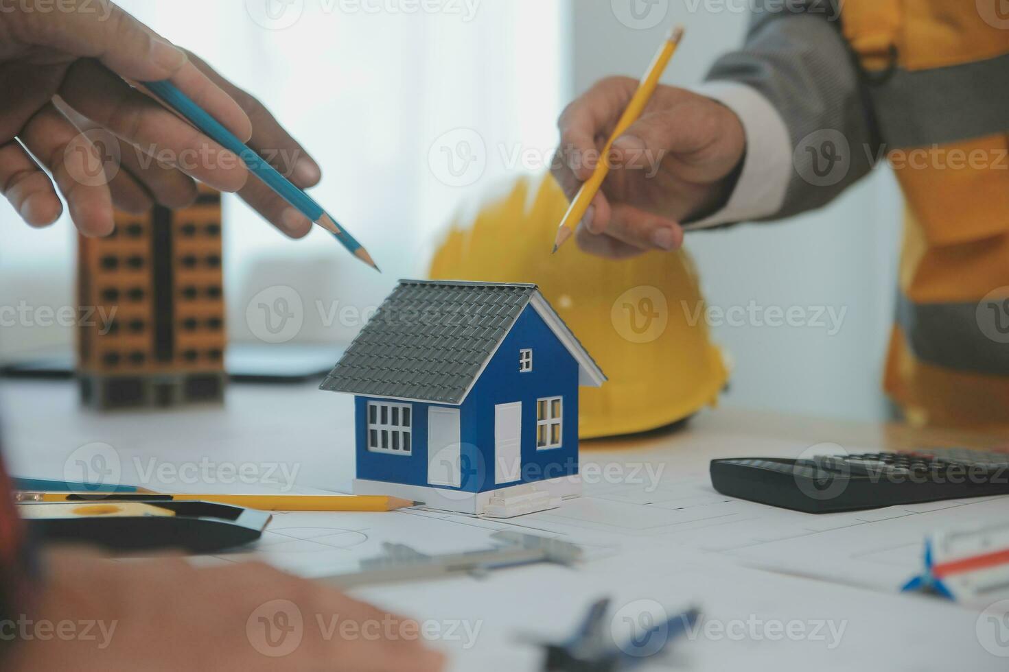 Construction and structure concept of Engineer or architect meeting for project working with partner and engineering tools on model building and blueprint in working site, contract for both companies. photo