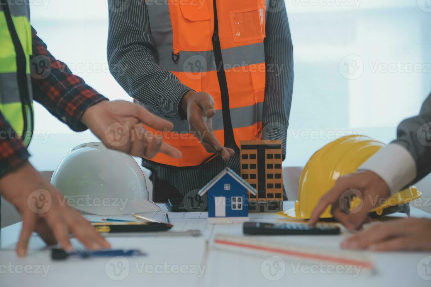 Construction and structure concept of Engineer or architect meeting for project working with partner and engineering tools on model building and blueprint in working site, contract for both companies. photo