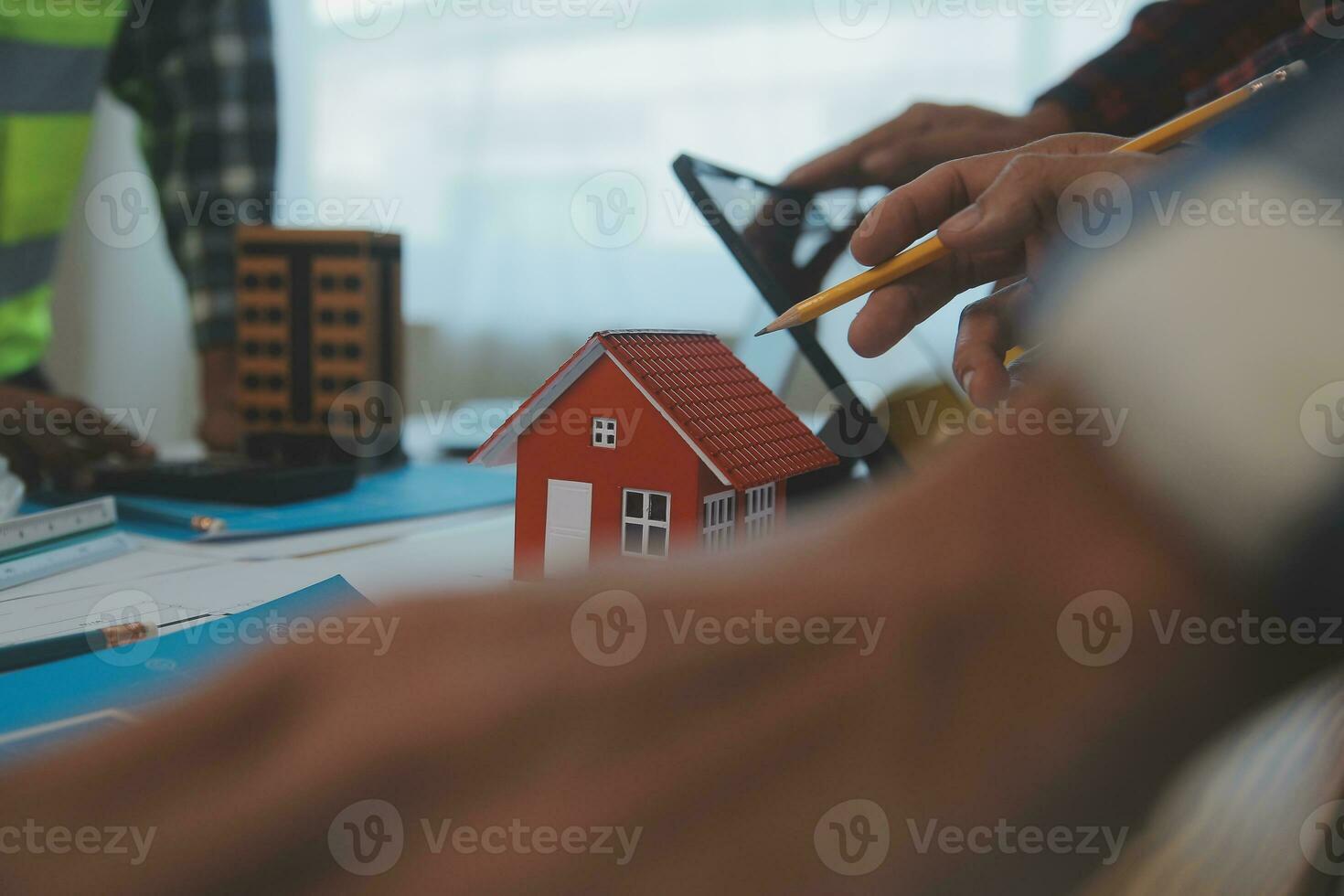 Construction and structure concept of Engineer or architect meeting for project working with partner and engineering tools on model building and blueprint in working site, contract for both companies. photo
