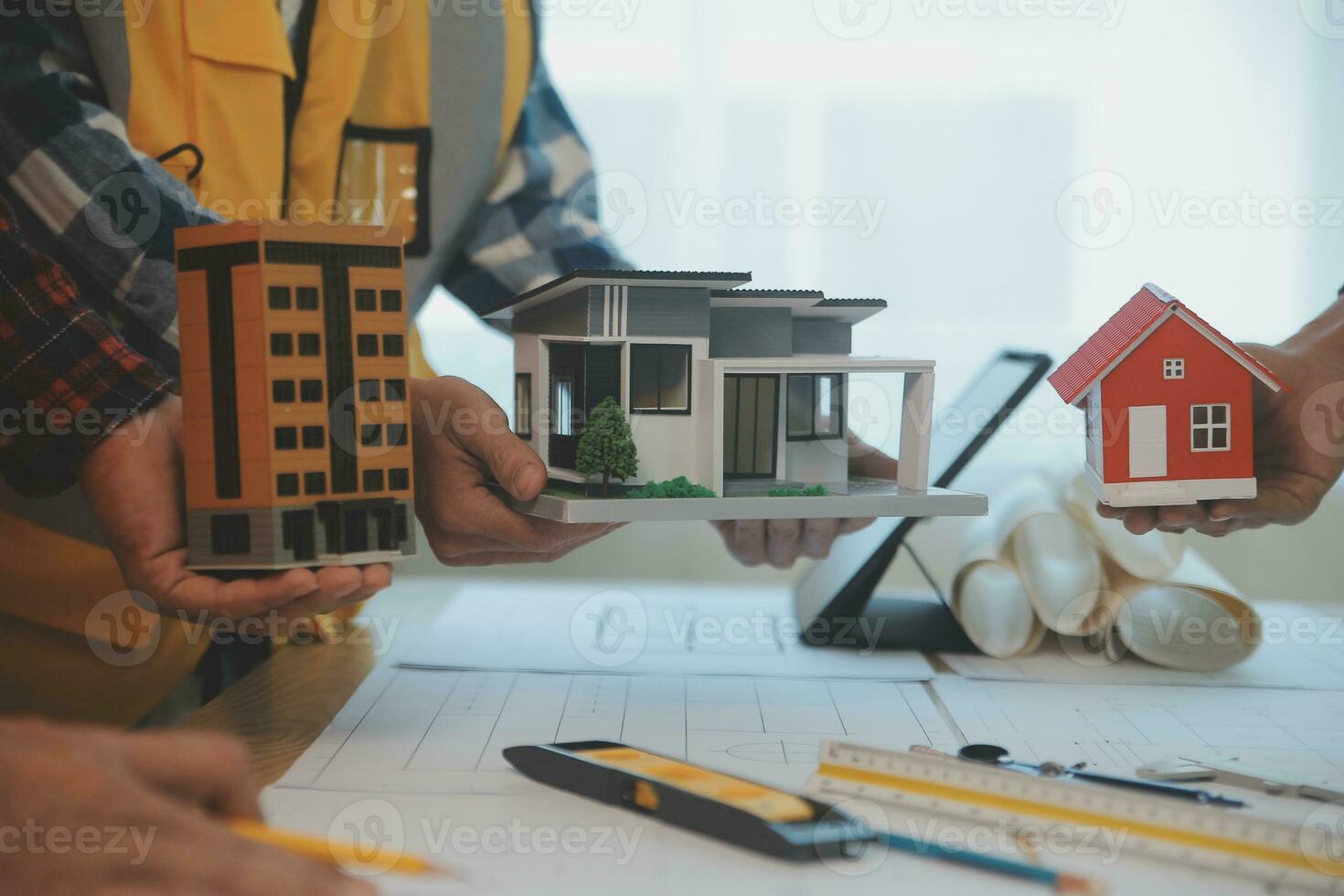 Construction and structure concept of Engineer or architect meeting for project working with partner and engineering tools on model building and blueprint in working site, contract for both companies. photo