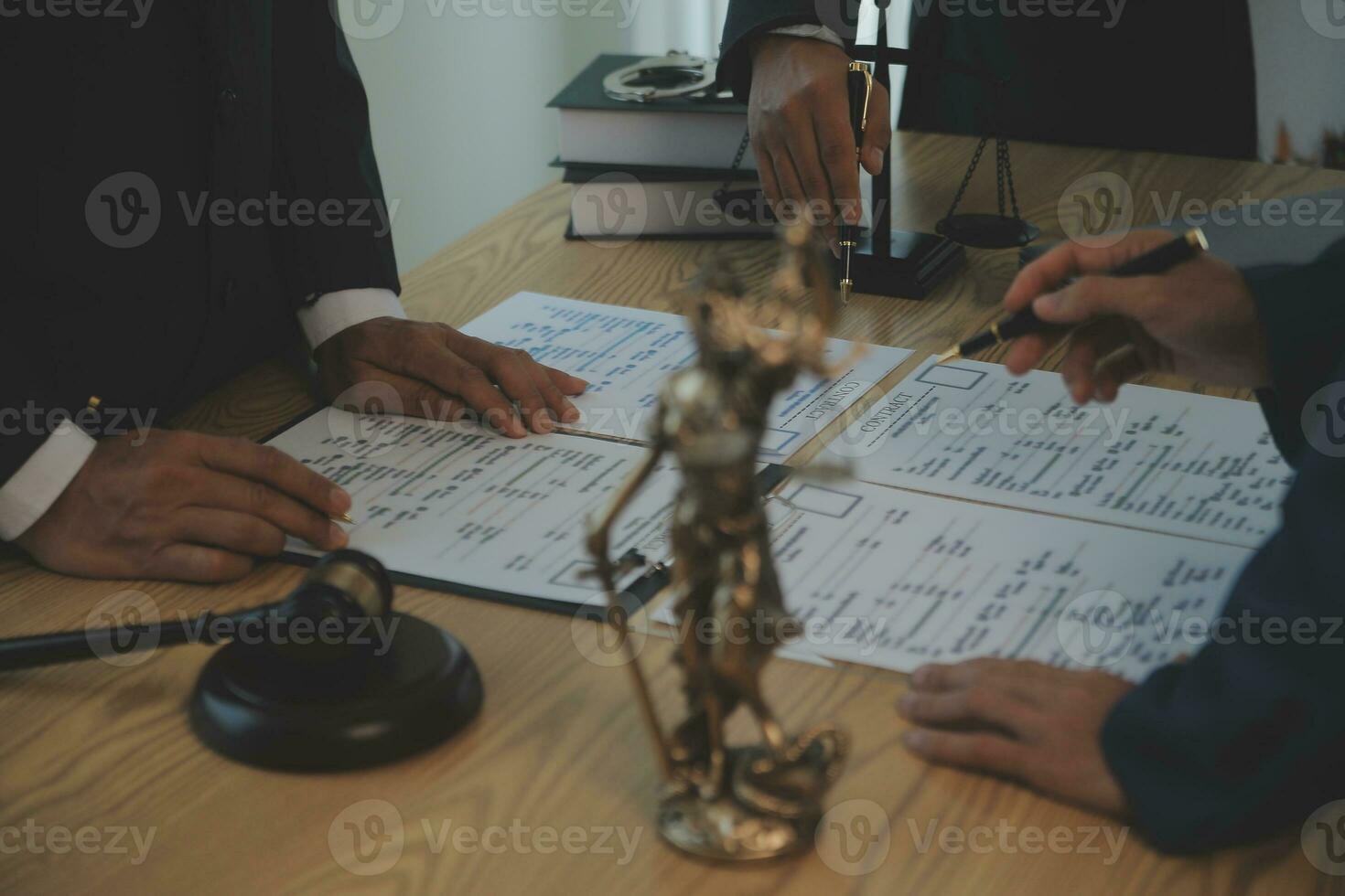 Consultation and conference of Male lawyers and professional businesswoman working and discussion having at law firm in office. Concepts of law, Judge gavel with scales of justice. photo