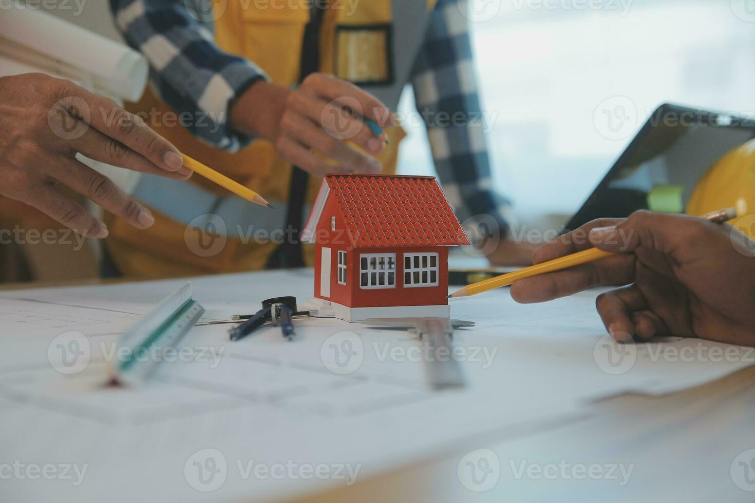 Construction and structure concept of Engineer or architect meeting for project working with partner and engineering tools on model building and blueprint in working site, contract for both companies. photo