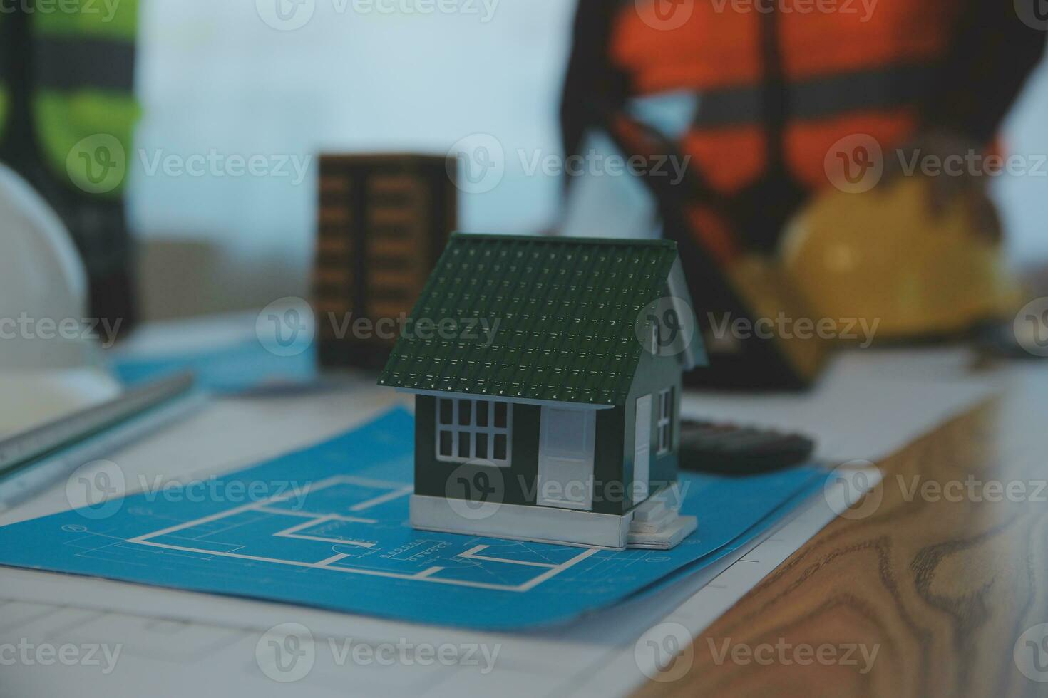 Construction and structure concept of Engineer or architect meeting for project working with partner and engineering tools on model building and blueprint in working site, contract for both companies. photo