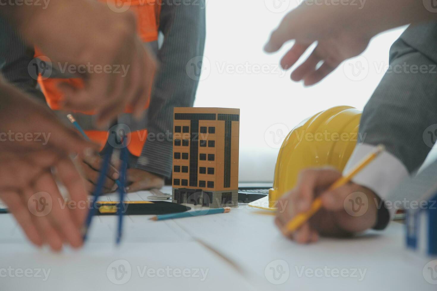 Construction and structure concept of Engineer or architect meeting for project working with partner and engineering tools on model building and blueprint in working site, contract for both companies. photo