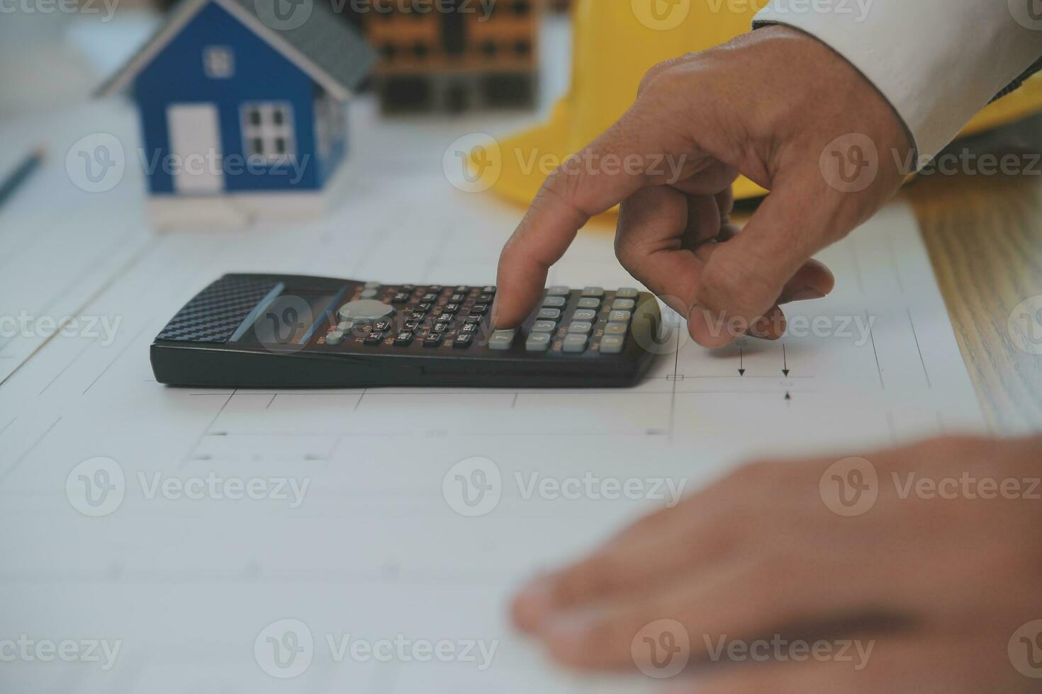 Construction and structure concept of Engineer or architect meeting for project working with partner and engineering tools on model building and blueprint in working site, contract for both companies. photo