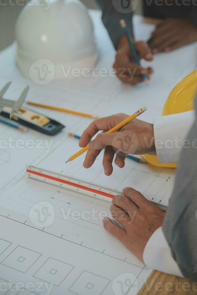 Construction and structure concept of Engineer or architect meeting for project working with partner and engineering tools on model building and blueprint in working site, contract for both companies. photo