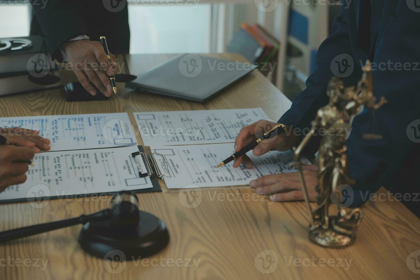 Consultation and conference of Male lawyers and professional businesswoman working and discussion having at law firm in office. Concepts of law, Judge gavel with scales of justice. photo