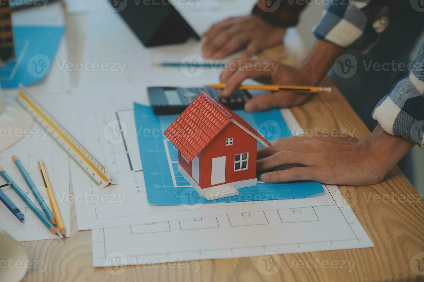 Construction and structure concept of Engineer or architect meeting for project working with partner and engineering tools on model building and blueprint in working site, contract for both companies. photo