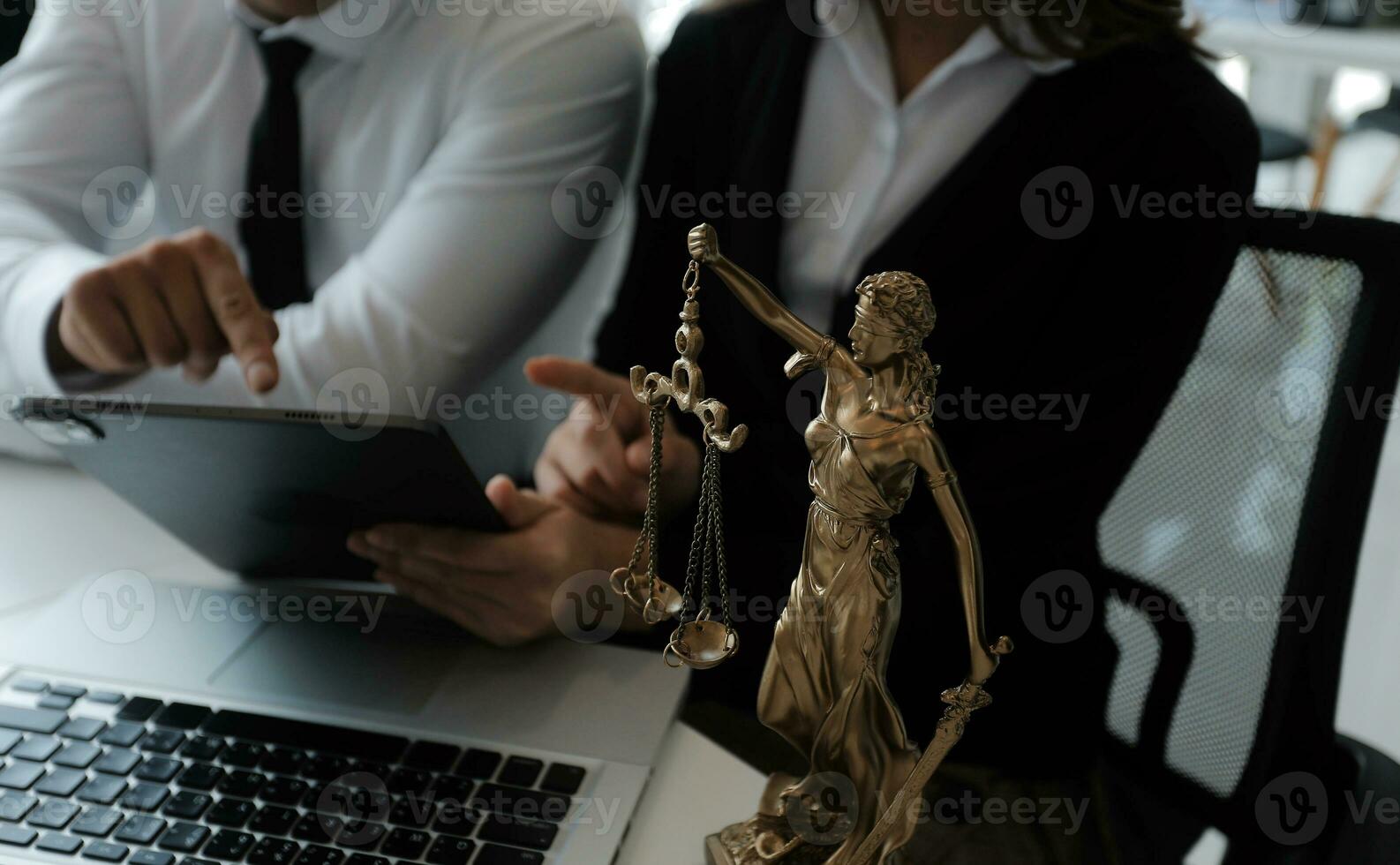 Male lawyer working with contract papers and wooden gavel on tabel in courtroom. justice and law ,attorney, court judge, concept. photo