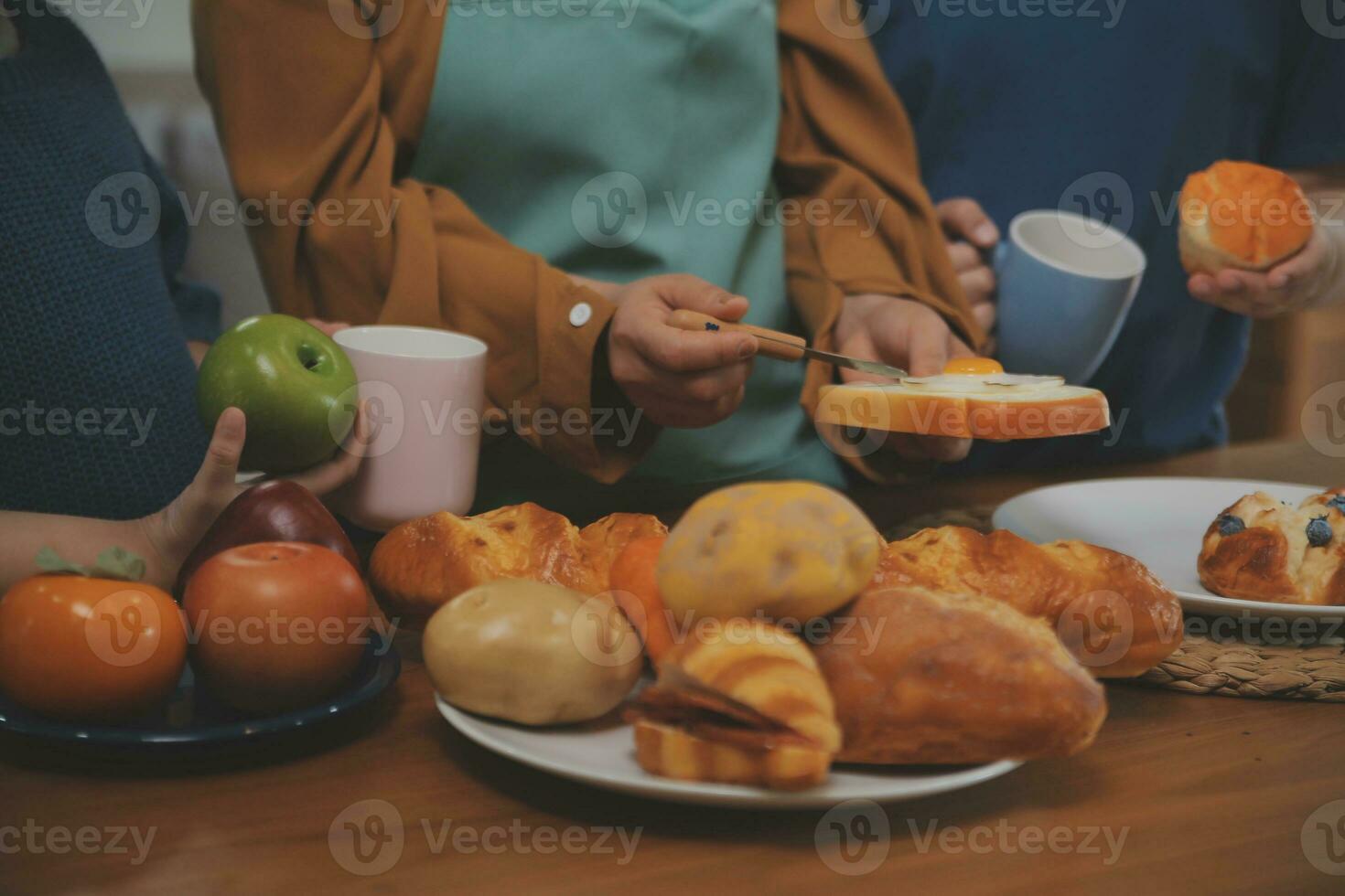 Caucasian attractive couple baking bakery with son in kitchen at home. Happy Family-father, mother and young boy having fun spending time together using ingredient making foods. Activity relationship. photo