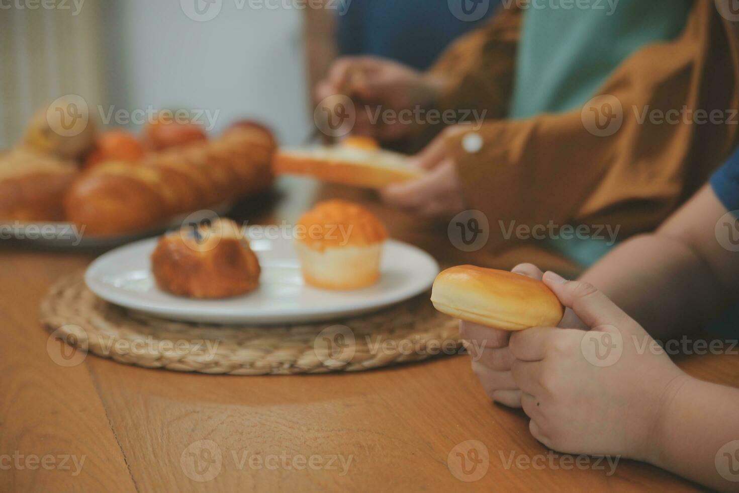 Caucasian attractive couple baking bakery with son in kitchen at home. Happy Family-father, mother and young boy having fun spending time together using ingredient making foods. Activity relationship. photo