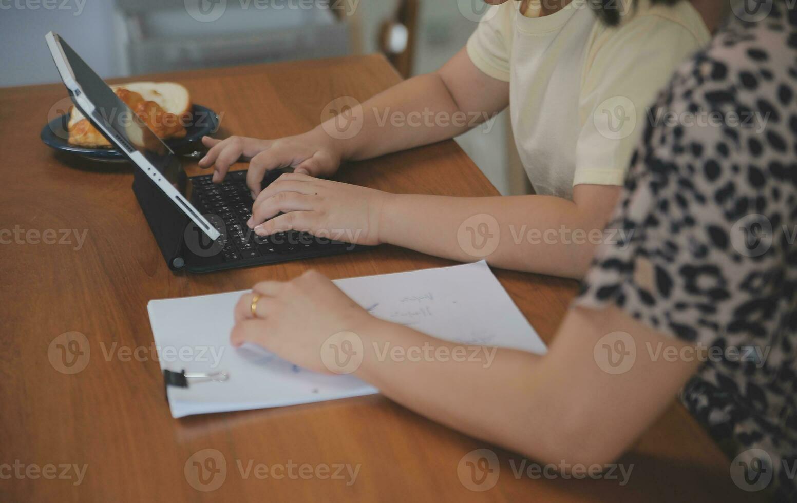 Caucasian attractive couple baking bakery with son in kitchen at home. Happy Family-father, mother and young boy having fun spending time together using ingredient making foods. Activity relationship. photo