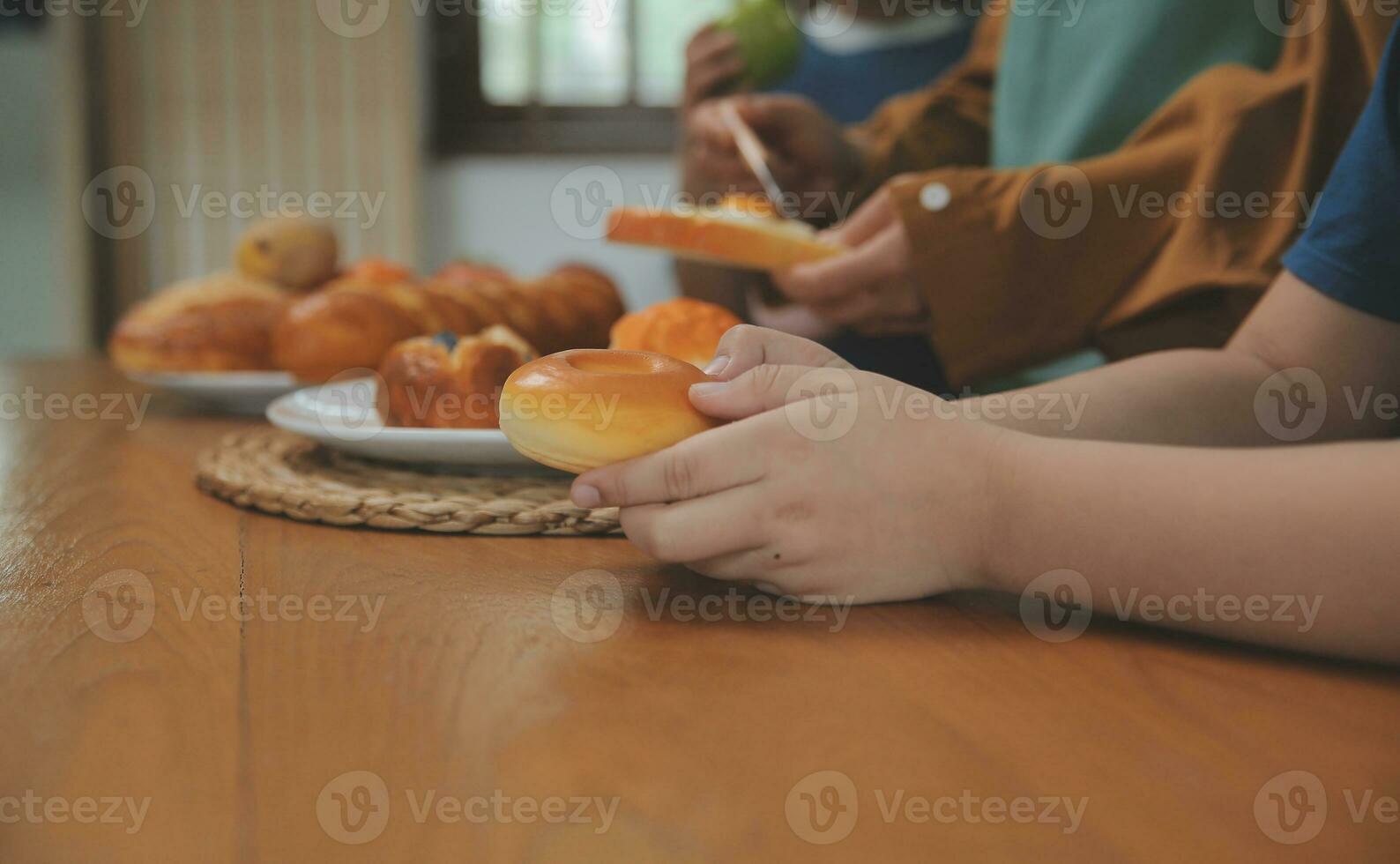 Caucasian attractive couple baking bakery with son in kitchen at home. Happy Family-father, mother and young boy having fun spending time together using ingredient making foods. Activity relationship. photo