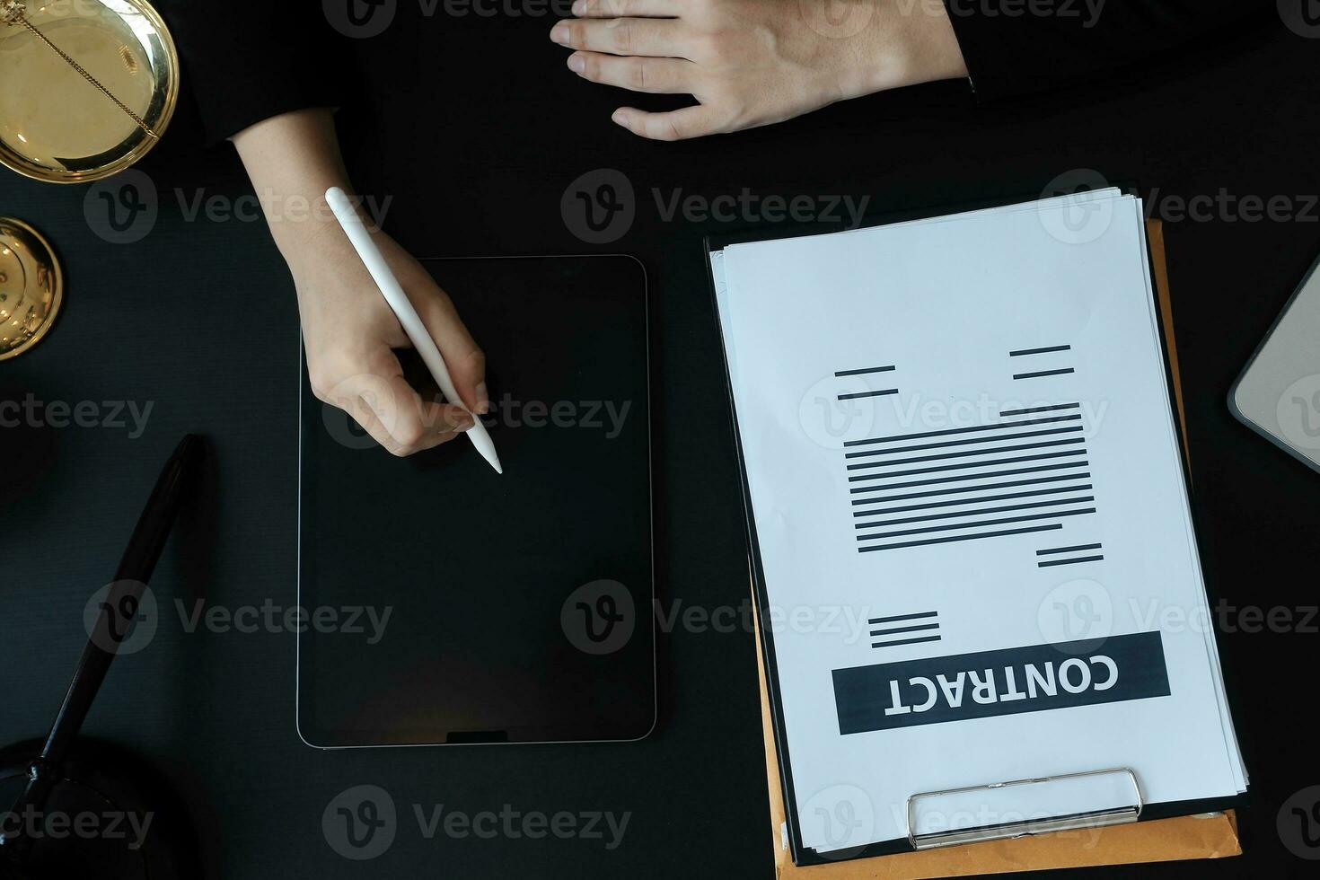 Male lawyer working with contract papers and wooden gavel on tabel in courtroom. justice and law ,attorney, court judge, concept. photo