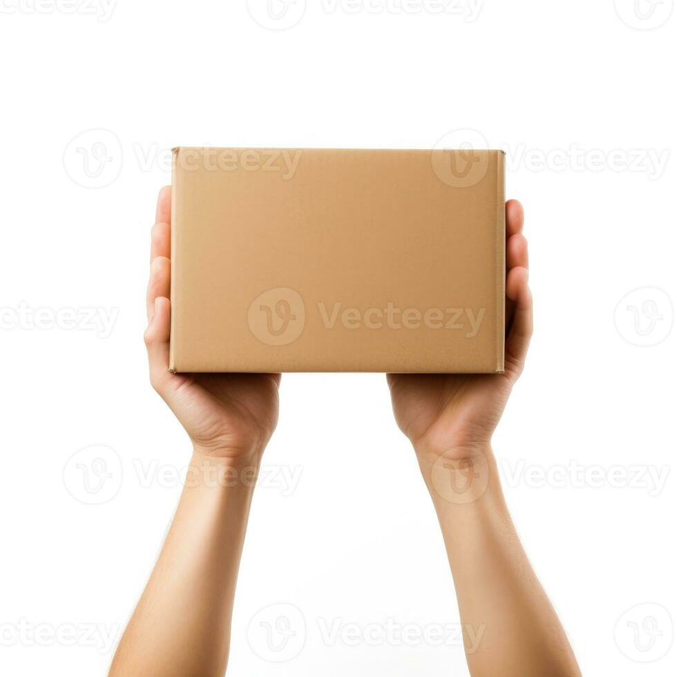 Female hands holding a brown cardboard box. photo