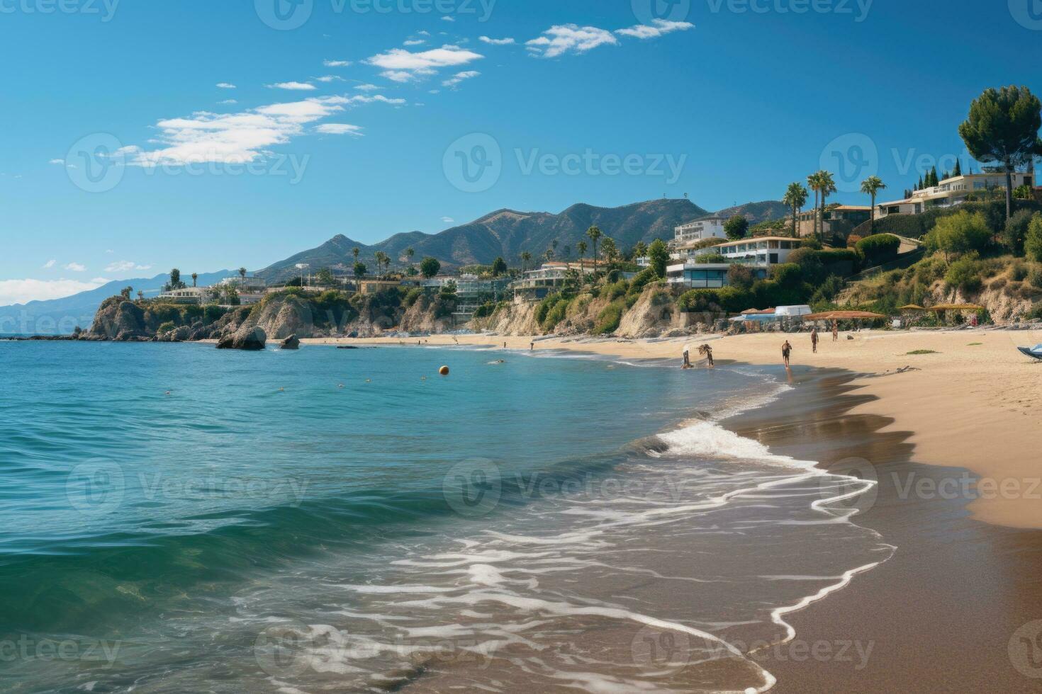 Beach view showing calm waves crashing on golden sand on a perfect summer day. View of the coastline in the town of Malibu, California. photo