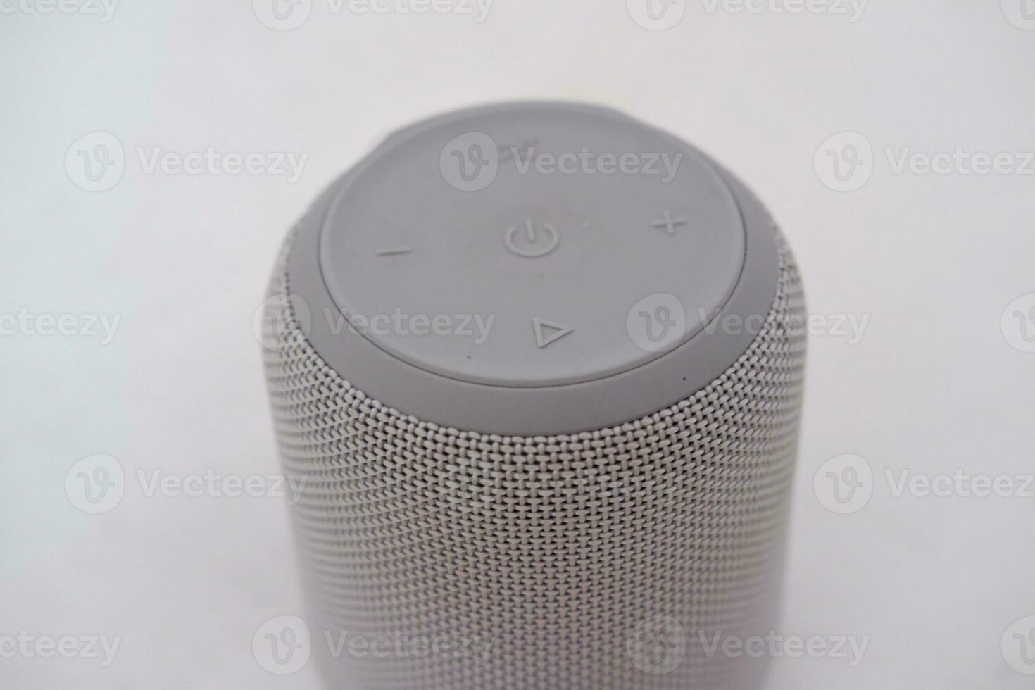 Wireless speaker on a white background. Close-up of speaker. photo