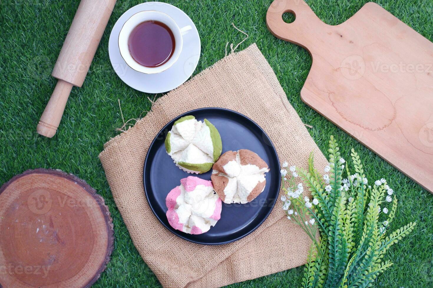 Bolu kukus is an Indonesian traditional sponge cupcake photo