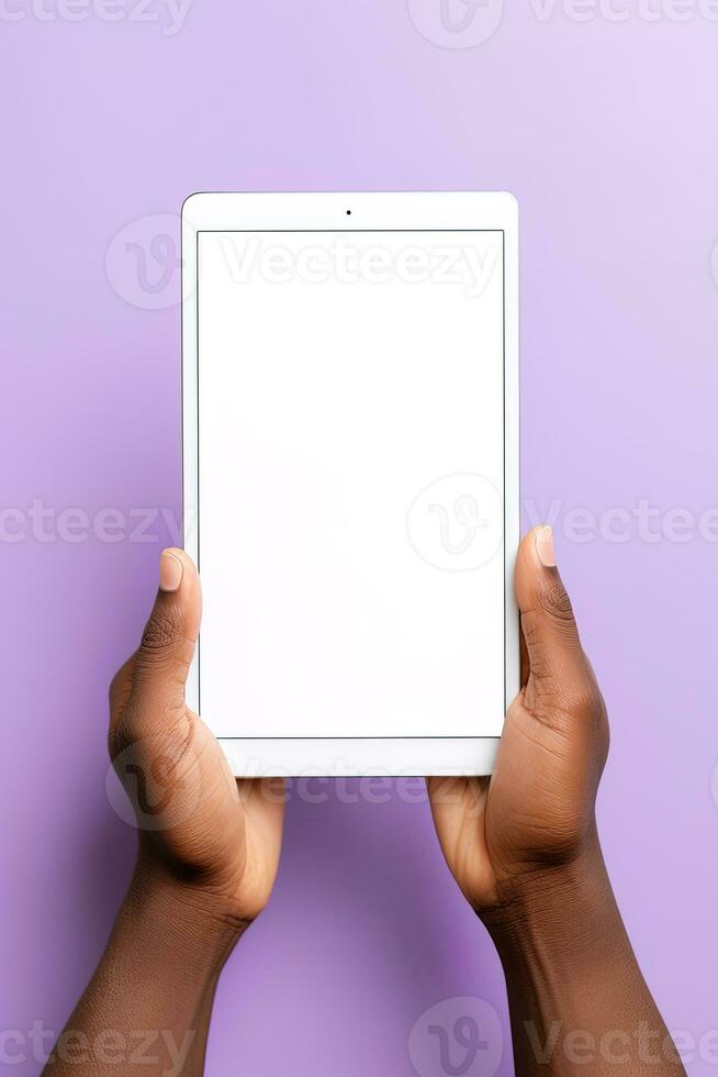 Hand holding tablet with mockup blank screen isolated on purple background. ai generated photo