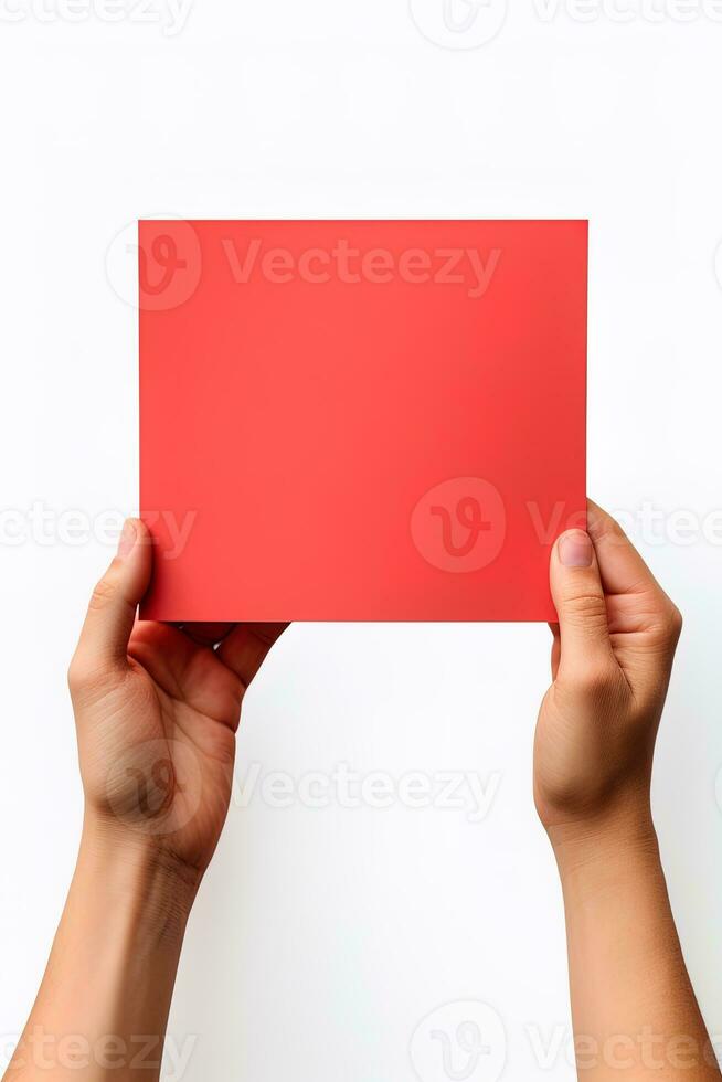 A human hand holding a blank sheet of red paper or card isolated on white background. ai generated photo