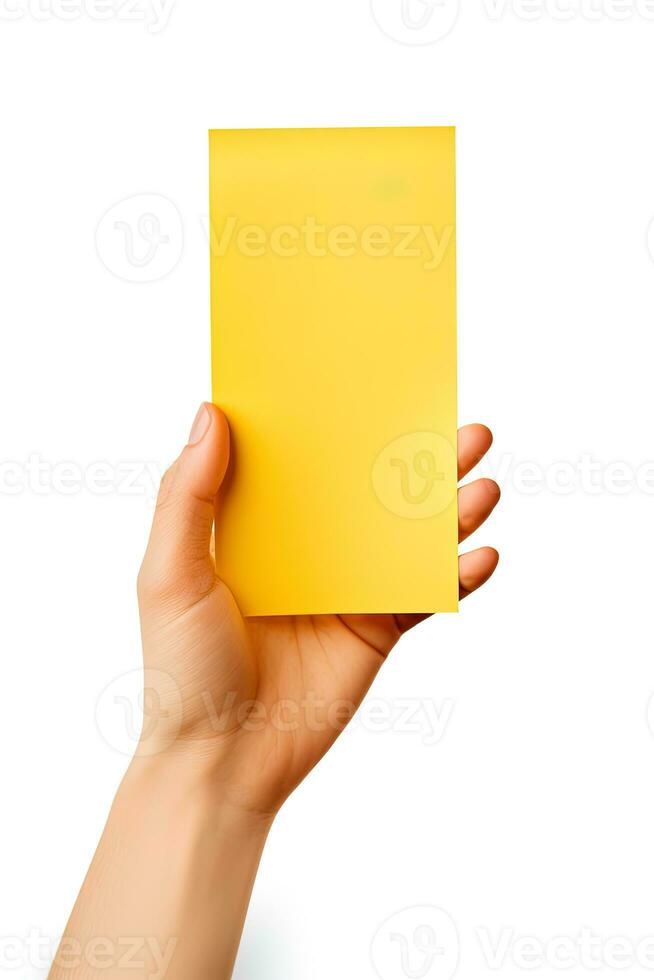 A human hand holding a blank sheet of yellow paper or card isolated on white background. ai generated photo