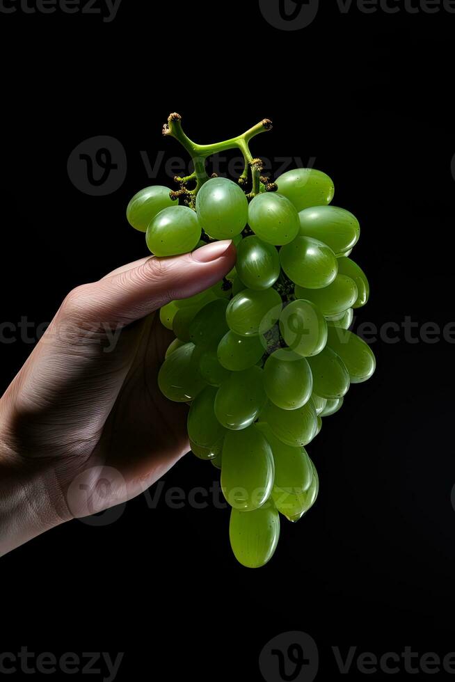 Hand holding green grapes bunch isolated on black background. ai generated photo