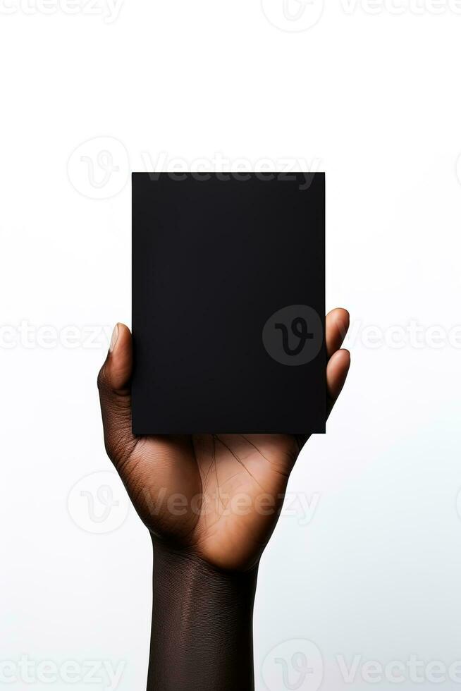 A human hand holding a blank sheet of black paper or card isolated on white background. ai generated photo