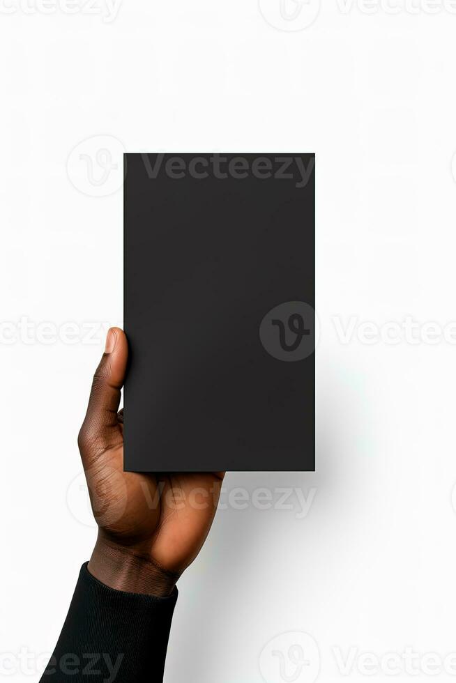 A human hand holding a blank sheet of black paper or card isolated on white background. ai generated photo