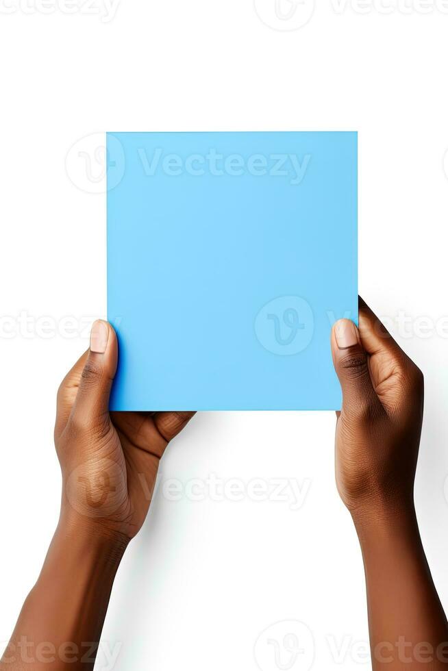 A human hand holding a blank sheet of blue paper or card isolated on white background. ai generated photo