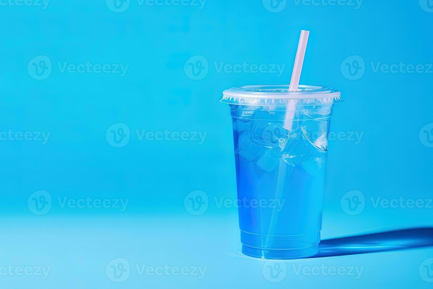 Blue drink in a plastic cup isolated on a blue background. Take away drinks concept with copy space. ai generated photo