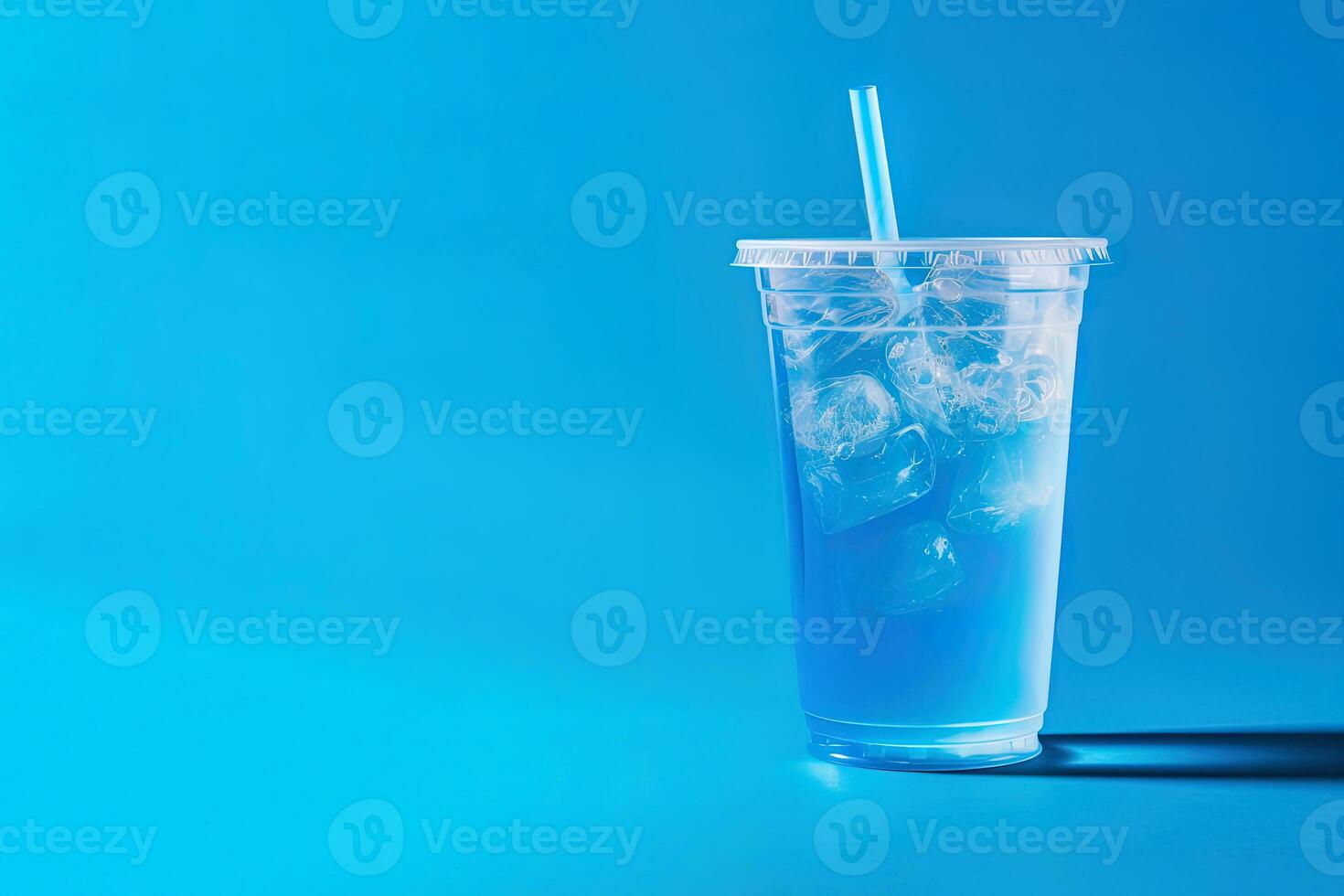 Blue drink in a plastic cup isolated on a blue background. Take away drinks concept with copy space. ai generated photo