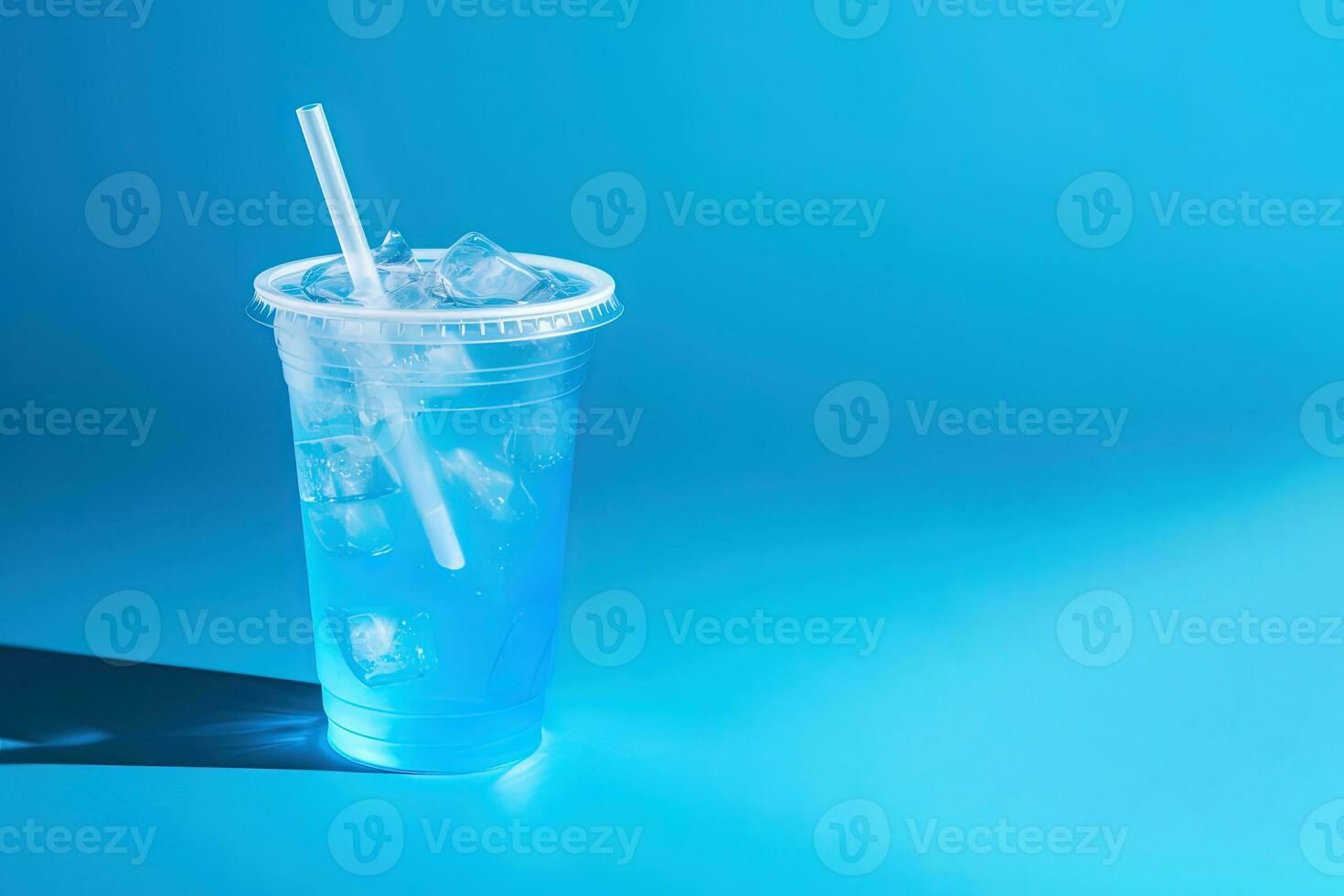 Blue drink in a plastic cup isolated on a blue background. Take away drinks concept with copy space. ai generated photo
