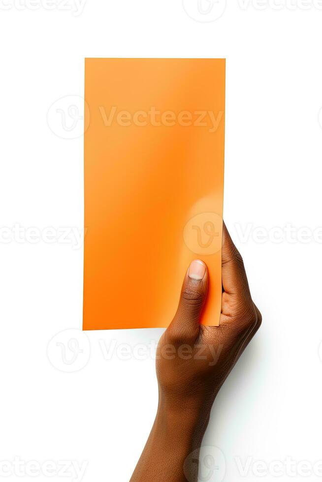 A human hand holding a blank sheet of orange paper or card isolated on a white background. ai generated photo