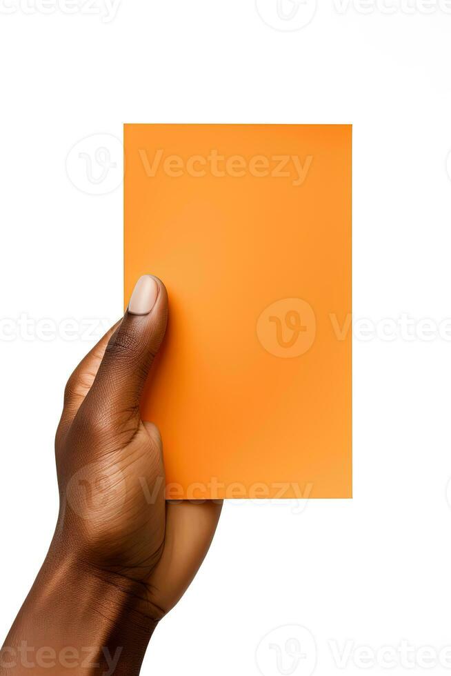 A human hand holding a blank sheet of orange paper or card isolated on a white background. ai generated photo