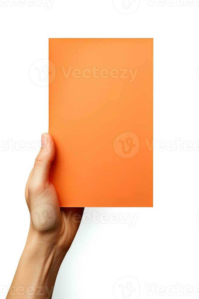 A human hand holding a blank sheet of orange paper or card isolated on a white background. ai generated photo