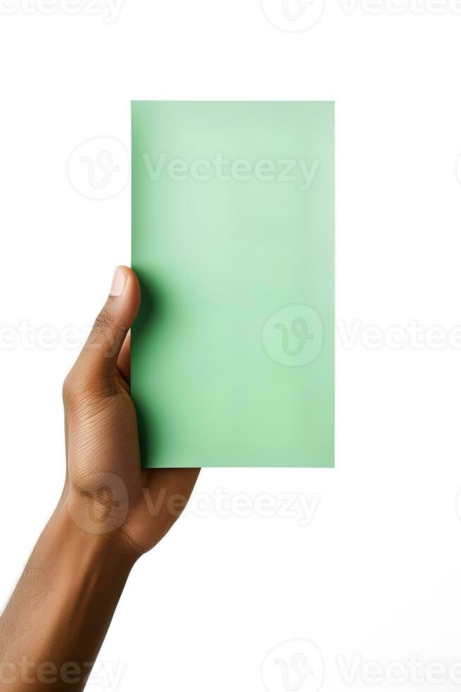 A human hand holding a blank sheet of green paper or card isolated on a white background. ai generated photo