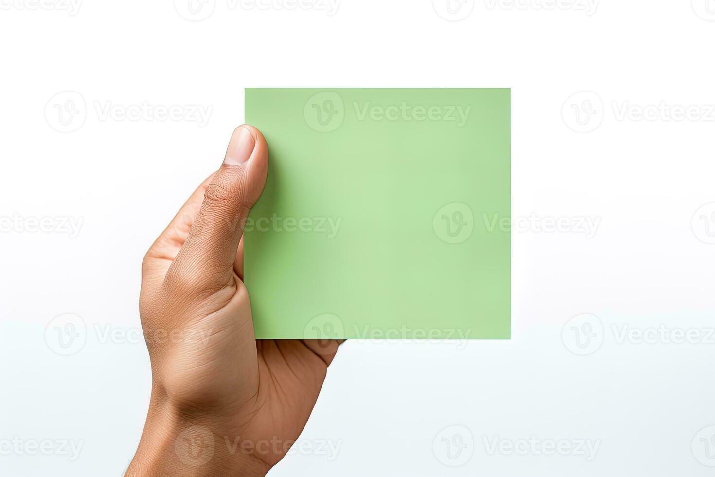 A human hand holding a blank sheet of green paper or card isolated on a white background. ai generated photo