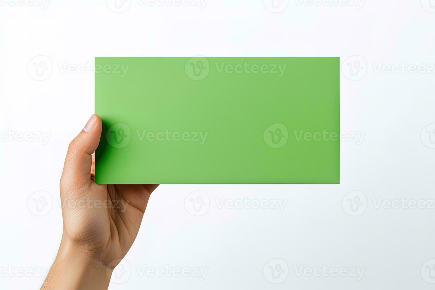 A human hand holding a blank sheet of green paper or card isolated on a white background. ai generated photo