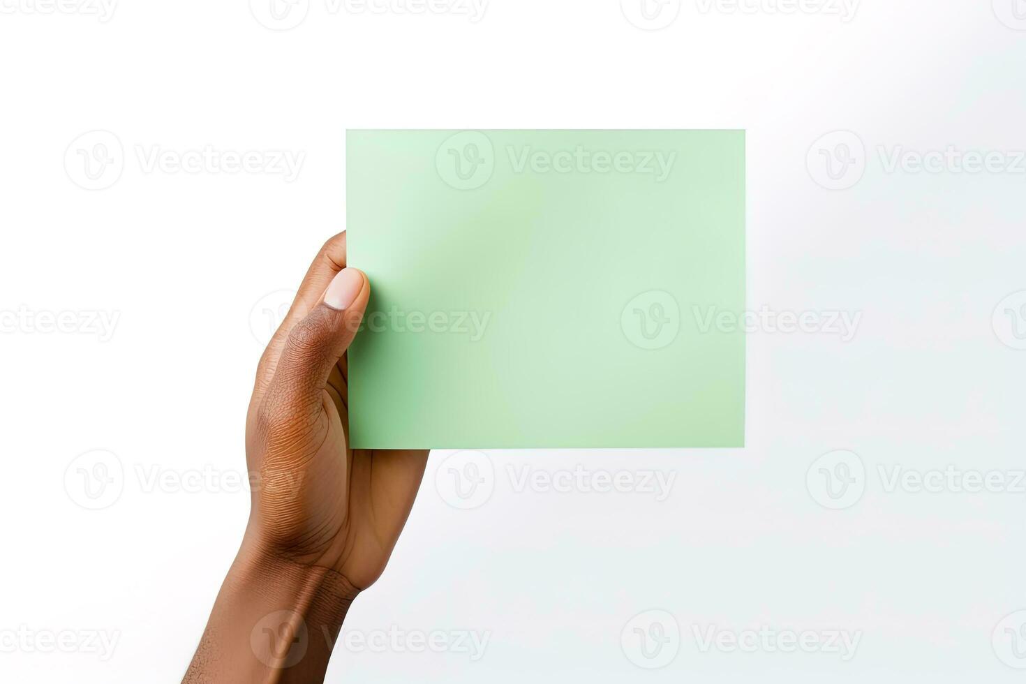 A human hand holding a blank sheet of green paper or card isolated on a white background. ai generated photo